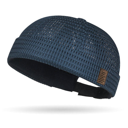 Breathable mesh cap with an adjustable strap